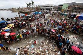 Victims of Typhoon Haiyan queue for food and water in Tacloban city, in the Philippines. 